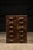 Wooden industrial cabinet. This piece features solid oak construction and original cast iron handles. Drawers (x12): 7.5"...