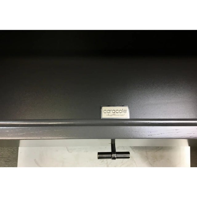 Original retail $4160, stylish Caracole Modern Taupe Fusion Sideboard, Carrara marble top, three shelves, one drawer, four...