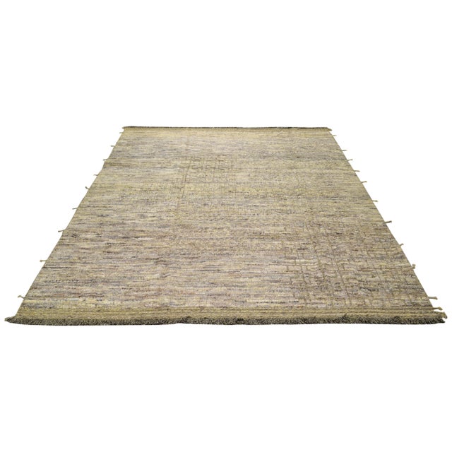 Hand-knotted with care using traditional rug-making techniques, this wool rug blends timeless craftsmanship with a modern...