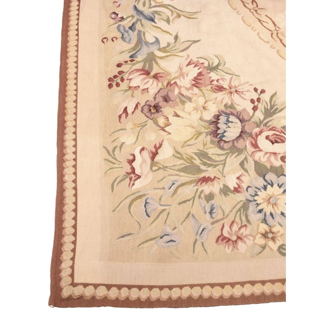 French tapestry with a floral pattern on the edges, in the style of Aubusson. End of the 19th century.