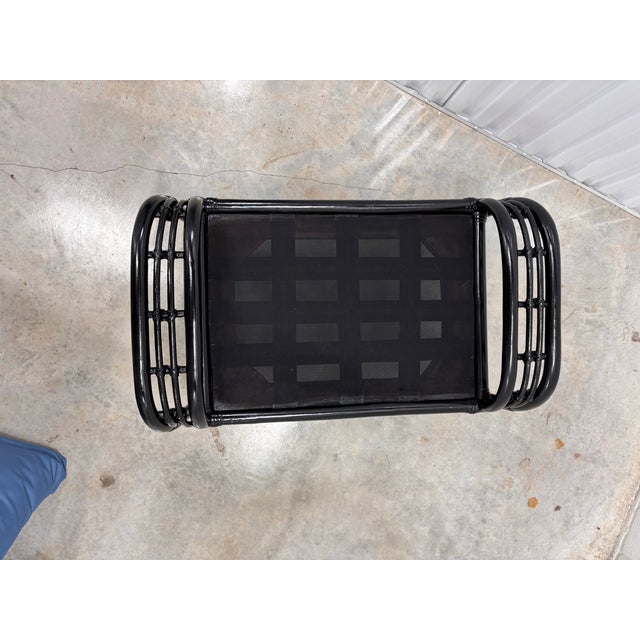 ENAMELED black rattan ottoman that matches black rattan and wicker chairs. There are 2 available. Well made McGuire styled...