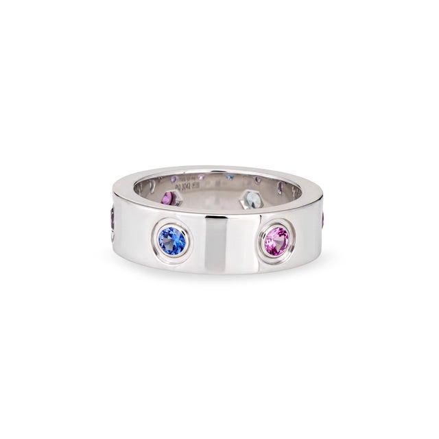 Pre-owned Cartier gemstone Love ring crafted in 18k white gold. Purple spinel, aquamarine, pink & blue sapphire and...