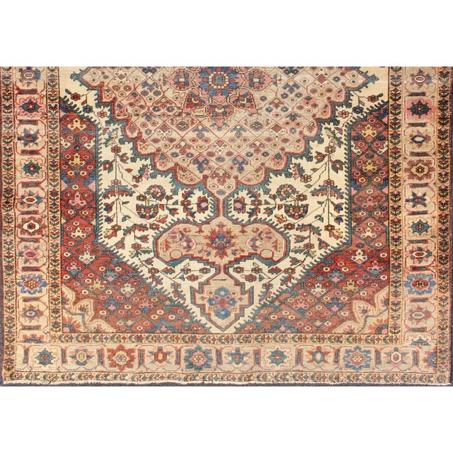 Keivan Woven Arts-Antique Ferahan Sarouk rug in ivory background, red brown, camel and teal, green and denim blue. Rug/....