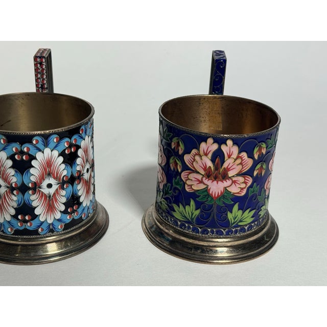 A collectible matching pair of vintage Russian silver cups crafted in 916-fineness silver. The 916 standard represents...