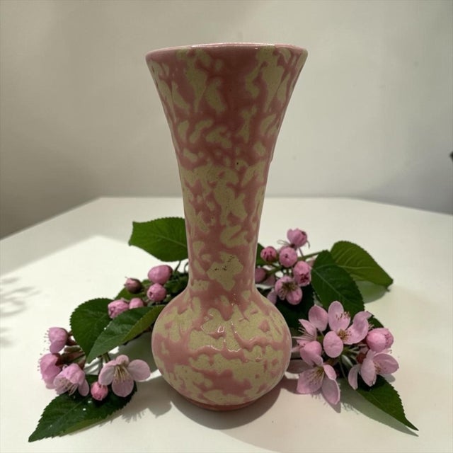 The McCoy Brocade vase featured distinctive mottled glazes with pink and cream. This vase was created using a sponge or...