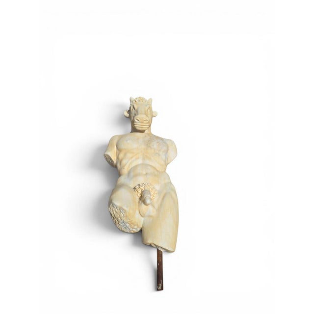 Striking marble sculpture depicting the Minotaur, one of the most iconic figures of Greek mythology. Carved in light-...