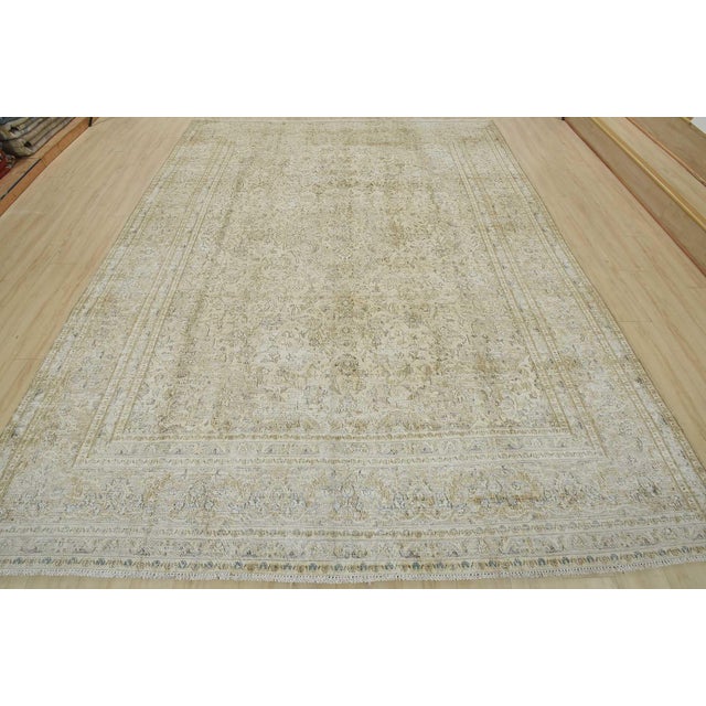 An authentic vintage traditional Tabriz rug hand-knotted with an all-wool pile on a cotton foundation. This oriental rug...