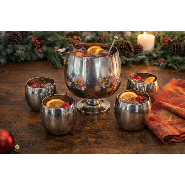 This vintage Poole EPCA Silverplate Punch Set is a stunning example of mid-century modern entertaining style. The set...