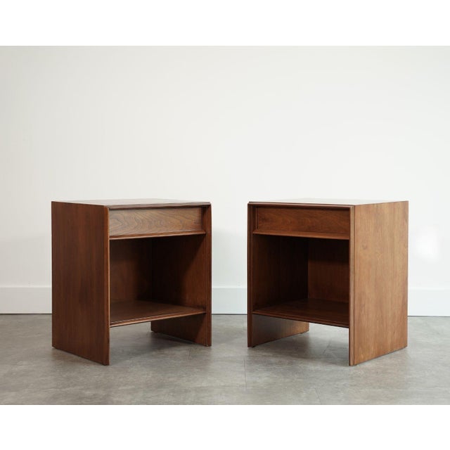 A refined example of American modernism, this rare pair of “Thin-Line” nightstands by T.H. Robsjohn-Gibbings for Widdicomb...