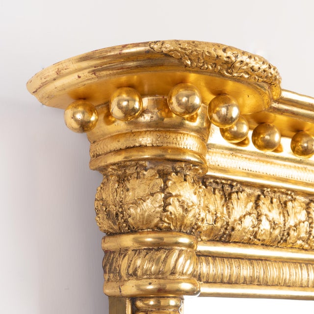An American Sheraton tabernacle mirror, attributed to Waterhouse of Albany, New York, circa 1810. The mirror frame is...