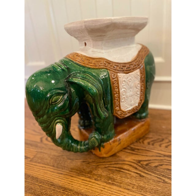 An exceptional and very charming large garden stool, mid-20th century. Chinese glazed ceramic elephant form garden seat....