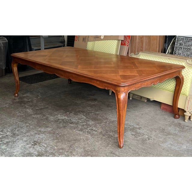 Early 20th Century Louis XV Style Parquet Dining Table. The top is screwed inot the base with old T screws and the bottom...