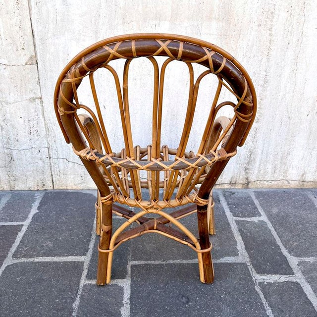 Children's bamboo armchair with armrests, vintage from the 1960s, in excellent condition. Perfect for playing in both the...