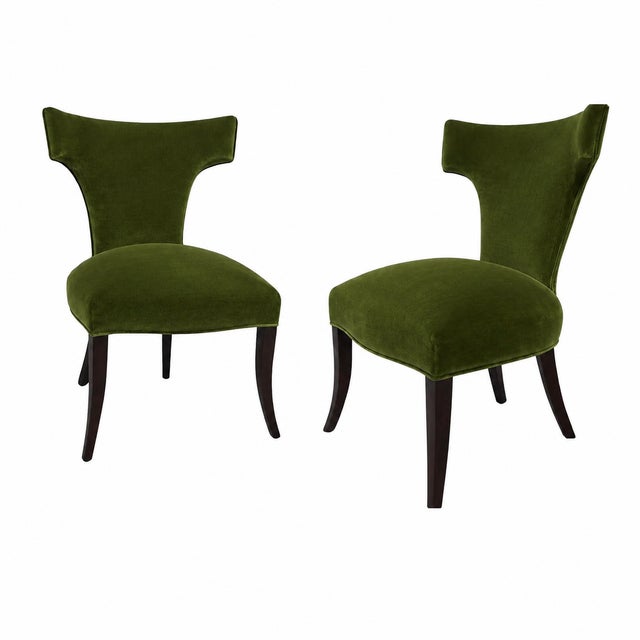 Modern mid century style Klismos dining chairs. Chairs are done in a cream Boulce fabric . The chairs are stunning and...