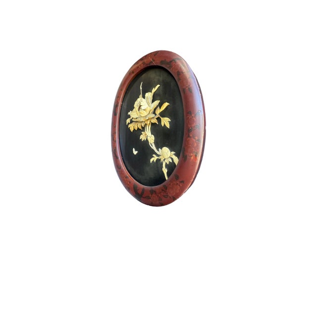 Pair of Japanese oval lacquered wall plaques with carved bone flowers and butterflies. C. 1890 Approx. 16.5” W x 0.75” D x...