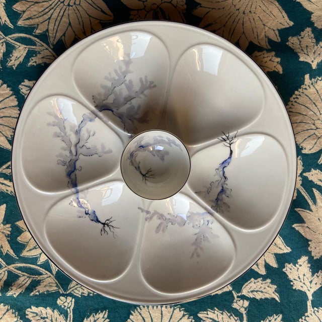Very rare set of French Limoges Oyster plates. Delicate and poetic, these rare plates have a central tumber for sauce /...
