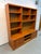 A beautifully crafted Danish Modern shelving unit by Uldum Møbelfabrik, showcasing the warmth and natural beauty of teak....