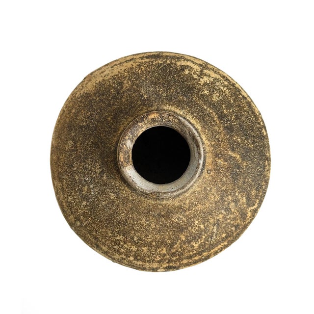 Antique small ceramic pot found along the coastlines of Indonesia. Beautiful displayed in groupings or singularly. Each is...