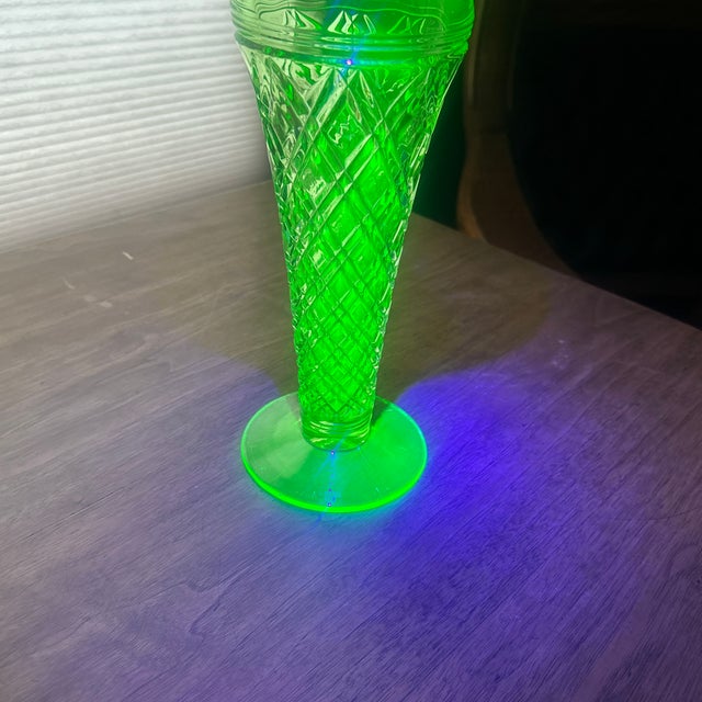 Glows under black light; stands 11” tall; no makers mark; beautifully made.
