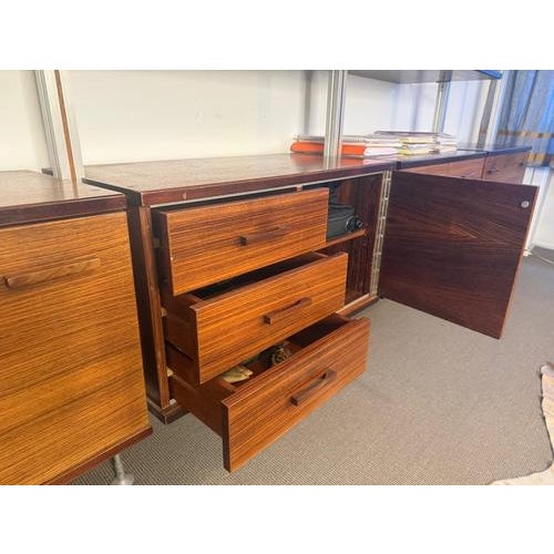 George Nelson modular bookcase, CSS Herman Miller, 1960, comprising four wooden cabinets with hinged doors and drawers,...