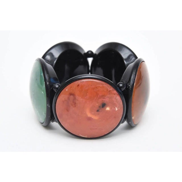 This is part of Chairish’s Costume Jewelry assortment. This great, dramatic vintage French resin disk bracelet has 5 disks...