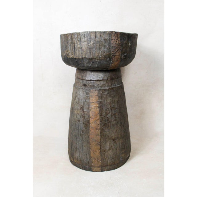 African grain stompers are made when they hollow out tree trucks and large branches to create these which are then used to...