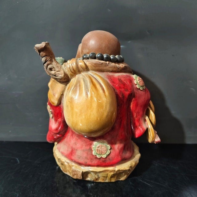 Invite joy, abundance, and positive energy into your home with this charming Vintage Shiwan Ware Laughing Buddha...