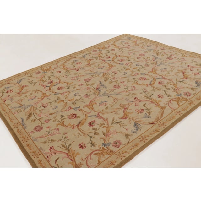 This 8x10 antique French Aubusson Needlepoint rug is a finely woven wool piece dating to circa 1890–1900. The rug features...