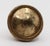 Concentric braided design entry door knob. Made of brass in a polished finish. The manufacturer and date of creation is...
