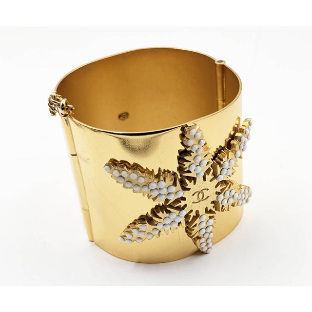 Contemporary Chanel Rare Vintage Gold Plated CC White Bead Snowflake Cuff Bracelet For Sale - Image 3 of 5