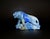 A striking hand-carved tiger sculpture in natural lapis lazuli, with intense coloration and natural marbling creating a...