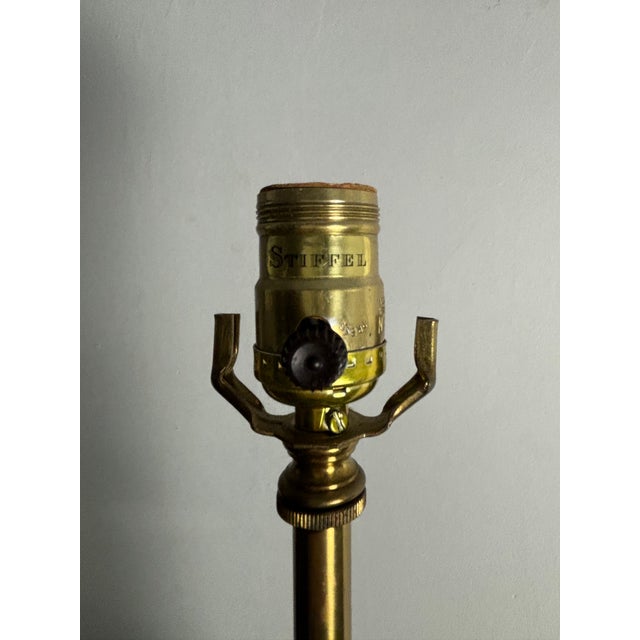 Elegant vintage table lamp by Stiffel featuring a sculptural blue crackle-glaze porcelain body with solid brass stem and...