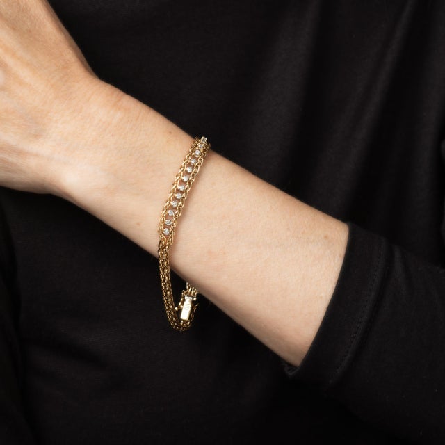 Stylish vintage diamond mesh crafted in 14 karat yellow gold (circa 1960s). 13 diamonds total an estimated 0.13 carats...