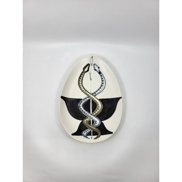 This ceramic bowl or trinket dish by Roger Capron, with its large, elegant, and refined oval shape, showcases a...