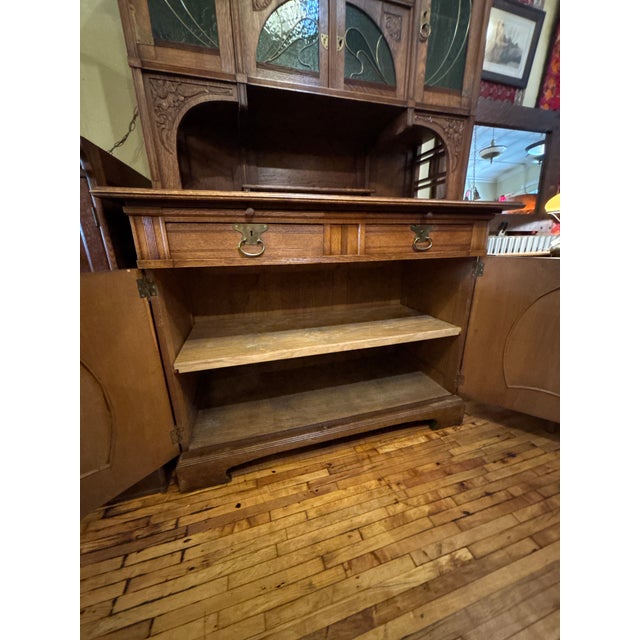 An incredible antique Art Nouveau buffet showcasing the movement’s signature blend of natural form and decorative...