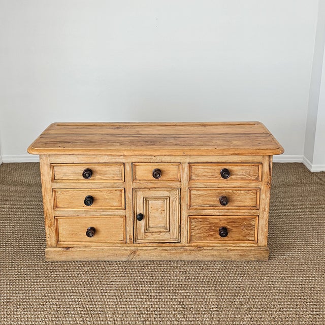 Dimensions:62"W x 21"D x 30.75"H A beautifully proportioned antique English pine sideboard offering generous storage and...