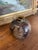 A small hand-thrown studio pottery vase signed "Nelson" on the base. This piece features a bulbous form with a narrow neck...