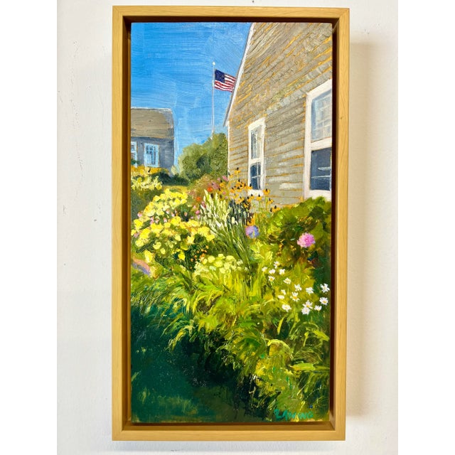 New England cedar shake coastal cottage surrounded by colorful summer blooms and the Stars and Stripes. Salt air, sunshine...