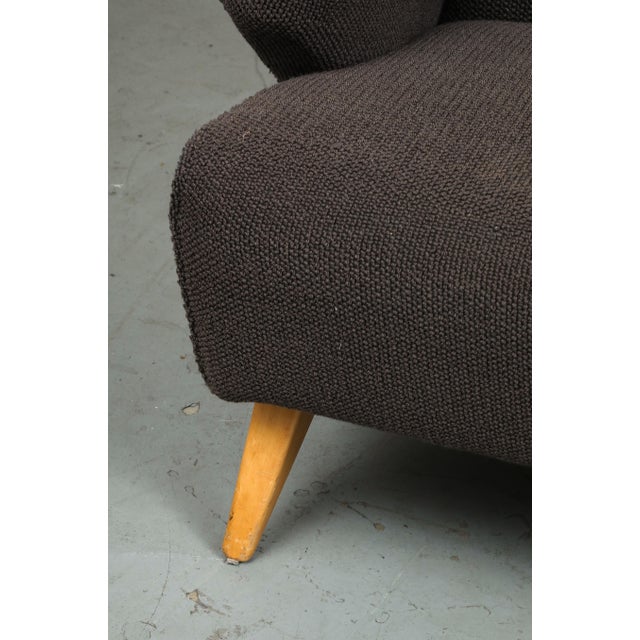 1940s Jens Risom Model 37 loveseat sofa for Knoll in charcoal grey upholstery atop tapered stained birch legs, a class...