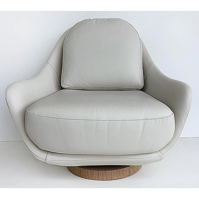 Artefacto Luna Leather Swivel Lounge Chair by Roberta Zimmerman. Offered for sale is a "Luna" model swivel lounge chair in...