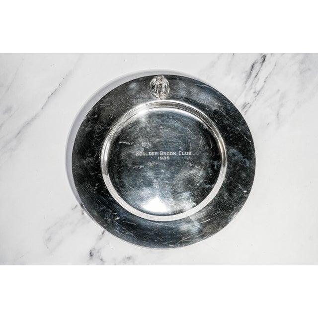 An elegant example of early 20th-century sporting memorabilia, this substantial silverplate presentation trophy plate was...