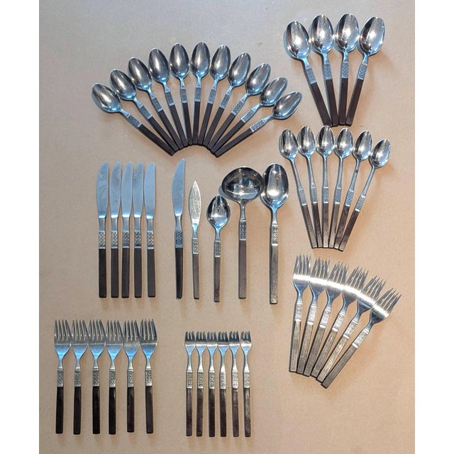 Offered is a set of Oneida stainless-steel and Teak composite flatware from its Northland collection of the "Anticipation"...