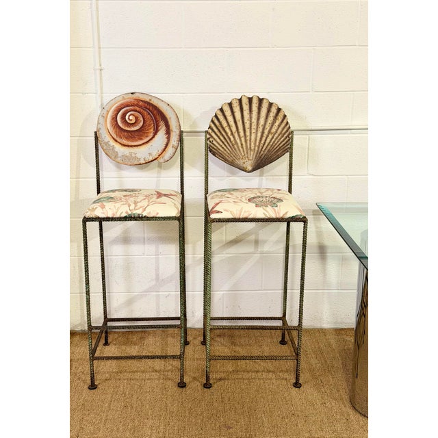 We are very pleased to offer this distinctive pair of bar stools, circa late 20th century, featuring hand-formed metal...