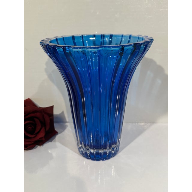This Cobalt Blue Studio Nova Vase is designed with it ribbing and flared at the rim. Studio Nova was launched by Mikasa in...