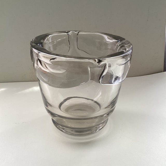 High quality, heavy blown art glass ice bucket. Sculptural base with molded loop handles inset near rim. Can be used as...