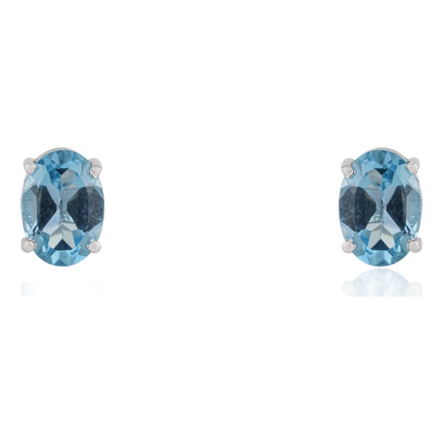 Classic 5x7mm Oval Blue Topaz Four Prong Stud Earrings in 925 Sterling Silver - A Pair For Sale