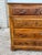 This impressive 19th-century French Louis Philippe walnut commode features four spacious drawers with richly carved floral...