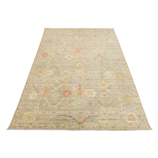 Enhance your space with this 10x18 oversized Oushak-style rug, blending traditional Turkish artistry with contemporary...