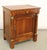 19th Century French Empire Walnut Nightstand with Brass Mounts A handsome 19th-century French Empire bedside cabinet or...