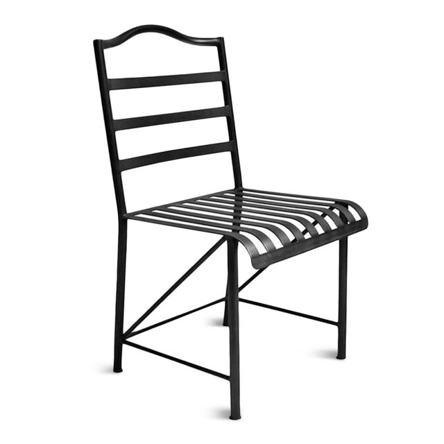 Classic vintage hand forged iron bistro dining chair with matte black powder coated finish. Wonderful for outdoor or...
